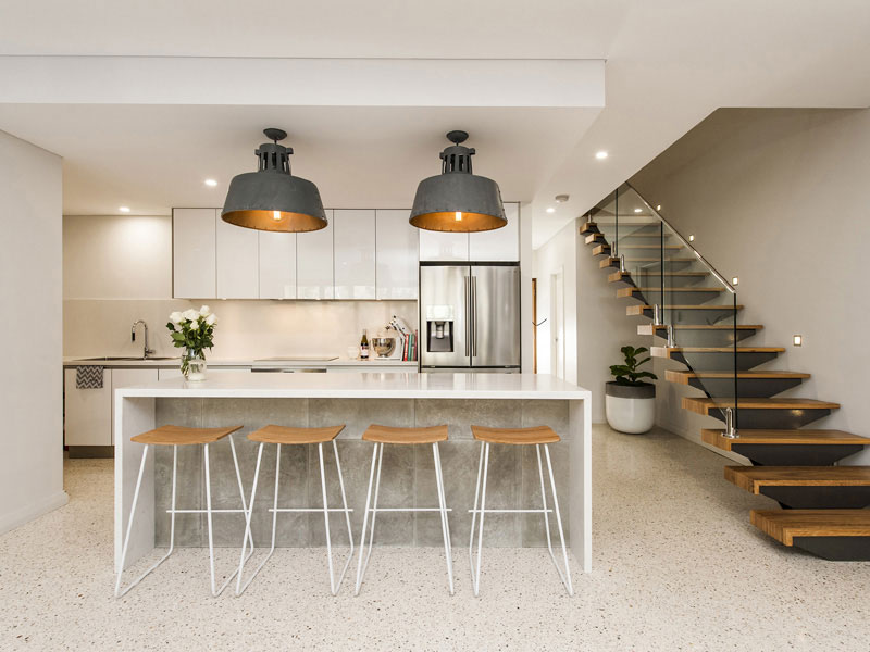 A kitchen counter on a honed concrete floor