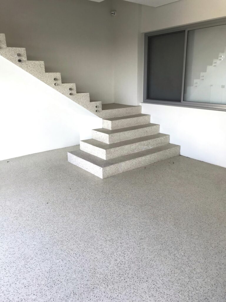 White polished concrete floor and staircase